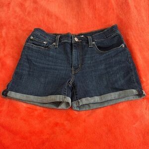 Blue Jean Shorts with Rolled Hems and Distressed Details